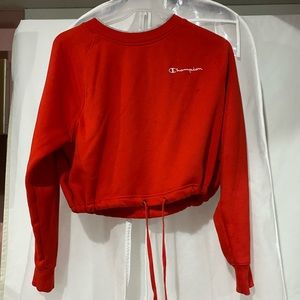 A red champion sweatshirt.